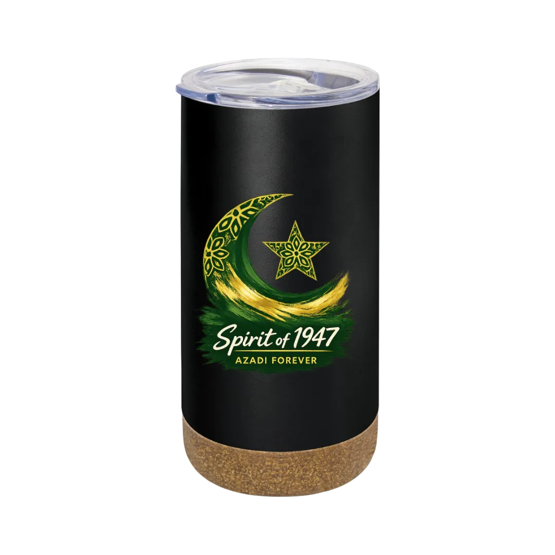 A black insulated tumbler with a clear lid and cork base, featuring a green and gold crescent moon and star graphic with the text 'Spirit of 1947' and 'AZADI FOREVER' on a light green background.