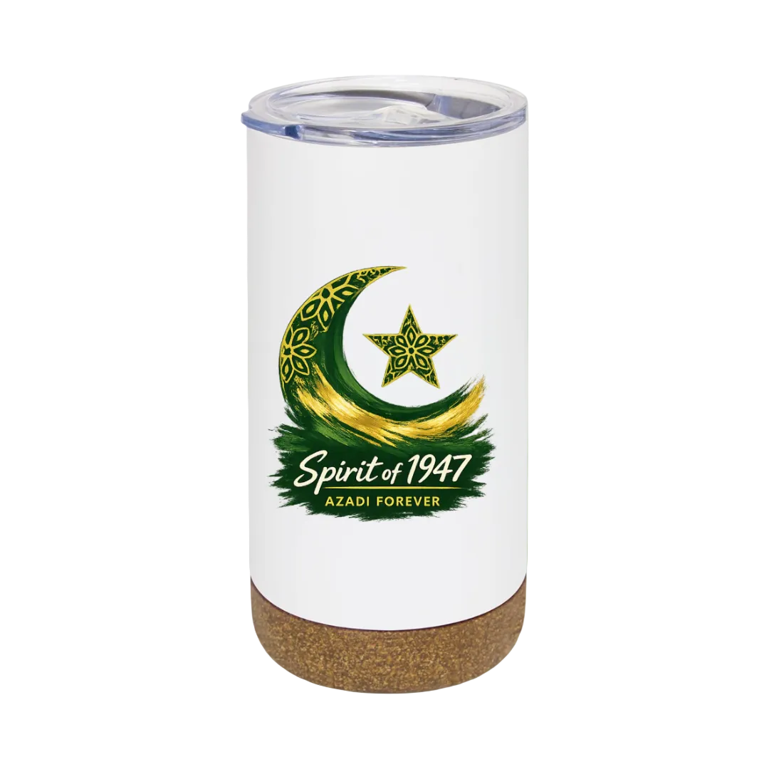 A white insulated tumbler with a clear lid and a cork base, featuring a green and gold crescent moon and star graphic with the text 'Spirit of 1947' and 'AZADI FOREVER' on the front, set against a solid light green background.