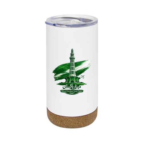 A white insulated tumbler with a clear lid and a cork base, featuring a green graphic of a minaret tower with the text 'Makkah Islamabad' and 'Where Freedom Wind Rises 1947'. The tumbler is centered on a solid light green background.