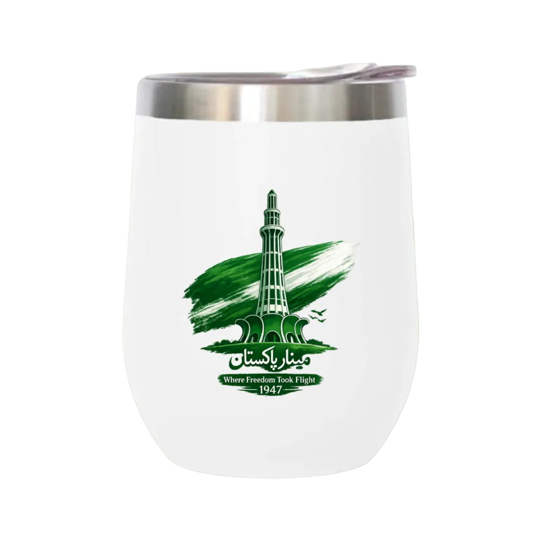 A white stemless wine tumbler with a stainless steel rim, featuring a green graphic of the Minkah Minaret in Islamabad, Pakistan, with the text 'Where Freedom Took Flight 1947' on a light green background.