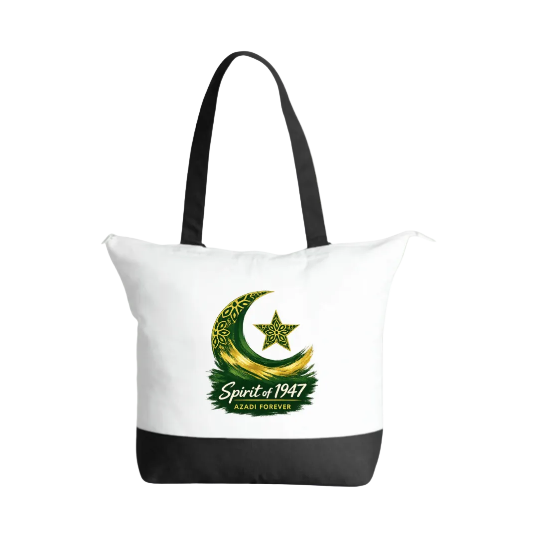 A white canvas tote bag with black handles and a black bottom panel, featuring a green and gold crescent moon and star graphic with the text 'Spirit of 1947' and 'AFSADI FOREVER' on the front, set against a light green gradient background.