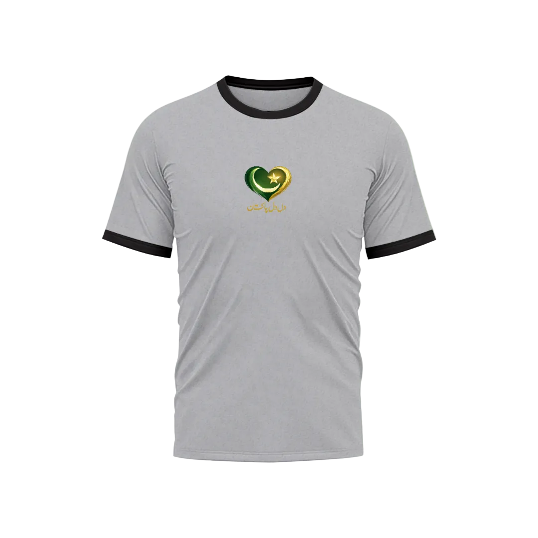 A light gray ringer t-shirt with black trim on the collar and sleeves, featuring a heart-shaped graphic in green, gold, and white on the chest with Arabic calligraphy underneath, set against a light green gradient background.