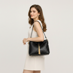 Model wearing black shoulder bag – square 1:1